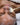 a woman gets a facial from a beautician